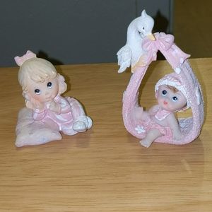 Baby girls stork sister or time progression statue